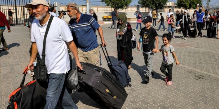 Foreign nationals and injured Palestinians allowed to flee Gaza for first time since Israel-Hamas war began