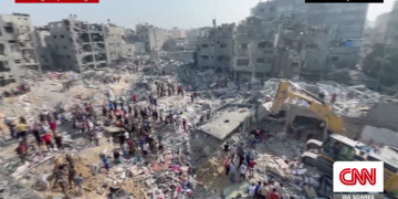 Airstrikes blast UN shelters, official says, as Israel announces complete encirclement of Gaza city