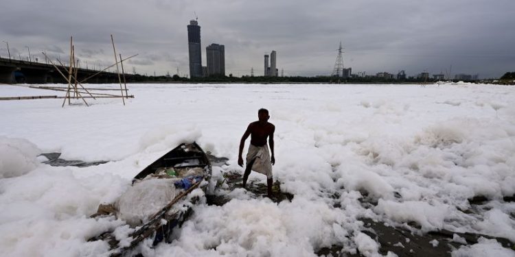 Toxic foam coats sacred river near New Delhi as Indian capital battles hazardous pollution