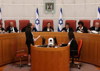 Israel’s top court strikes down key part of judicial overhaul, reigniting divisions as war rages
