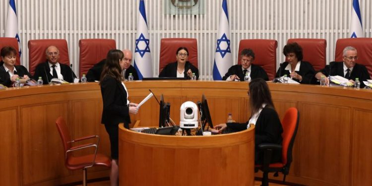 Israel’s top court strikes down key part of judicial overhaul, reigniting divisions as war rages