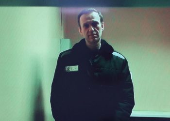 Jailed Kremlin critic Navalny makes first court appearance from Siberian penal colony