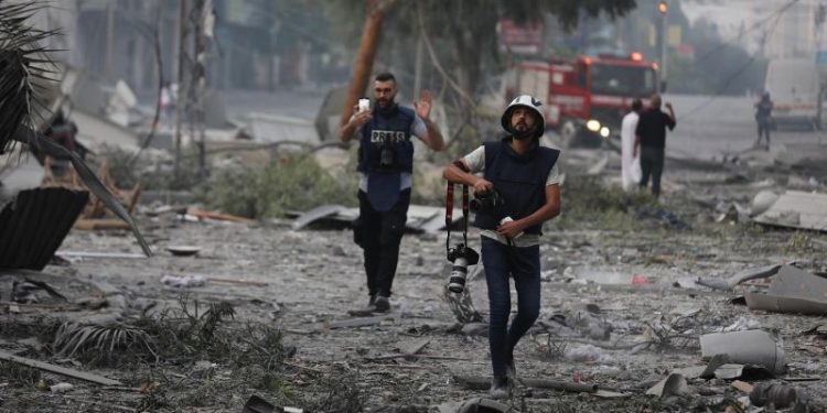 Palestinians are documenting the war for millions on social media. Their followers have come to see them as family.