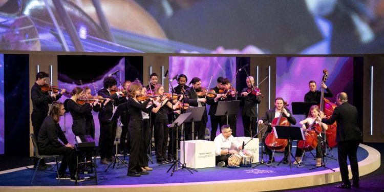 A conductor invited refugees who’d never played instruments to join his orchestra. It changed his life