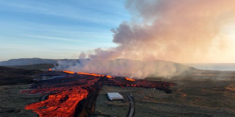 Buildings burn as lava from Icelandic volcano eruption flows into evacuated fishing town