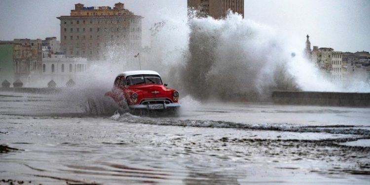 Huge waves and high winds hurl jellyfish and seaweed into the streets of Havana