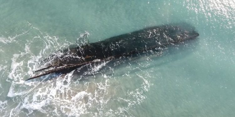 A fierce storm uncovered a mysterious shipwreck. Now another could destroy it