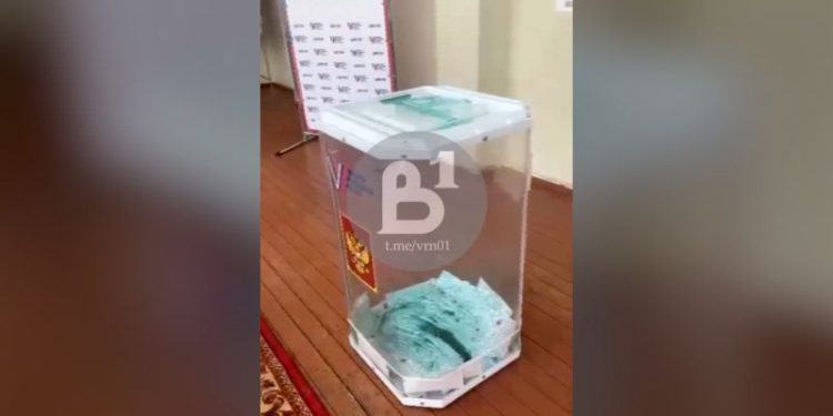 Russia opens criminal cases after protesters pour dye in ballot boxes and start fires with voting underway