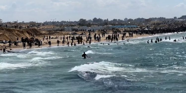 At least 12 Palestinians drown trying to retrieve aid parcels dropped into the sea