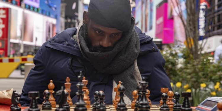 Nigerian chess champion Tunde Onakoya plays for 60 hours in Times Square, breaking marathon record
