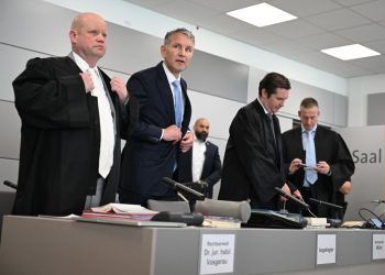 Far-right German politician on trial accused of using banned Nazi slogans