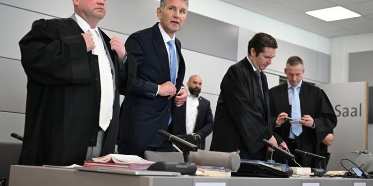 Far-right German politician on trial accused of using banned Nazi slogans