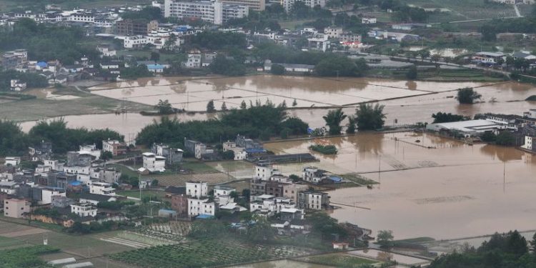 Massive floods threaten tens of millions as intense rains batter southern China