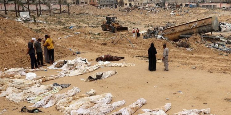 Almost 400 bodies have been found in mass grave in Gaza hospital, says Palestinian Civil Defense