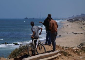 US military starts delivering aid to Gaza through floating pier. Here’s what we know