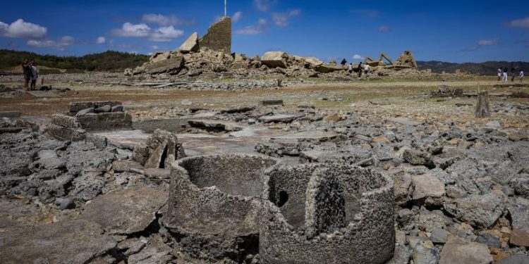A 300-year-old settlement resurfaces as severe drought dries up a dam in the Philippines