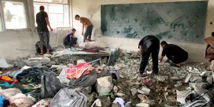 Israeli airstrike kills dozens sheltering in UN school, Gaza officials say
