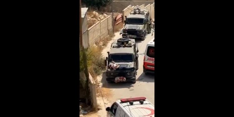 Israeli military straps injured Palestinian man to hood of jeep