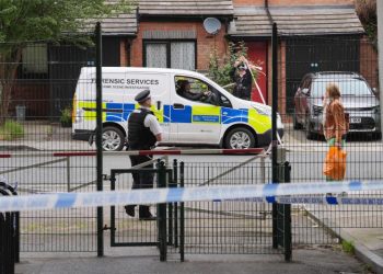 Man charged with double murder after human remains found in suitcases on UK bridge