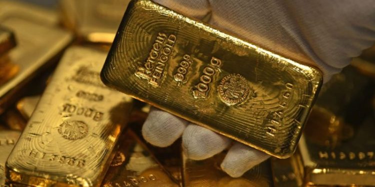 Gold jumps to record above $2,460 an ounce on hopes Fed will soon cut rates