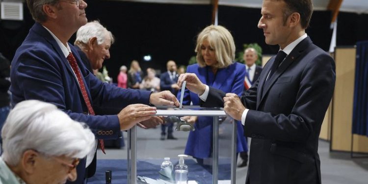 Macron urges new mainstream coalition, appearing to rule out working with the far left