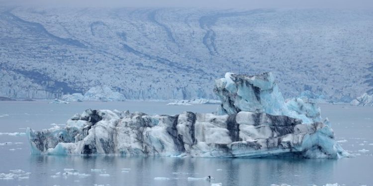 Ice cave collapse kills tourist as rescuers search for two missing in Iceland