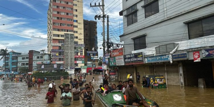 Millions in this country are stranded by flooding. Many blame their neighbor