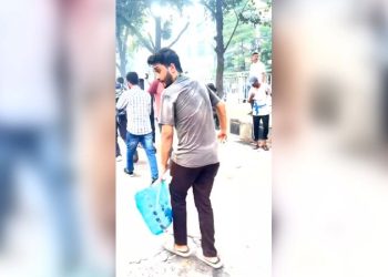 This student was handing out bottles of water to protesters. Minutes later, he was dead