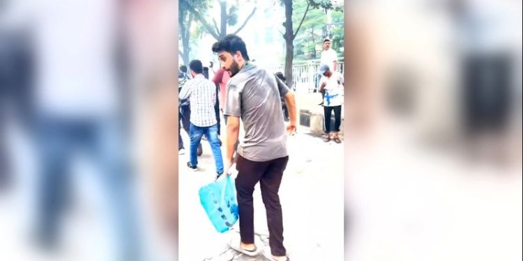 This student was handing out bottles of water to protesters. Minutes later, he was dead