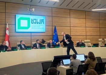 Georgia election chief doused in paint as protests continue after divisive parliamentary vote