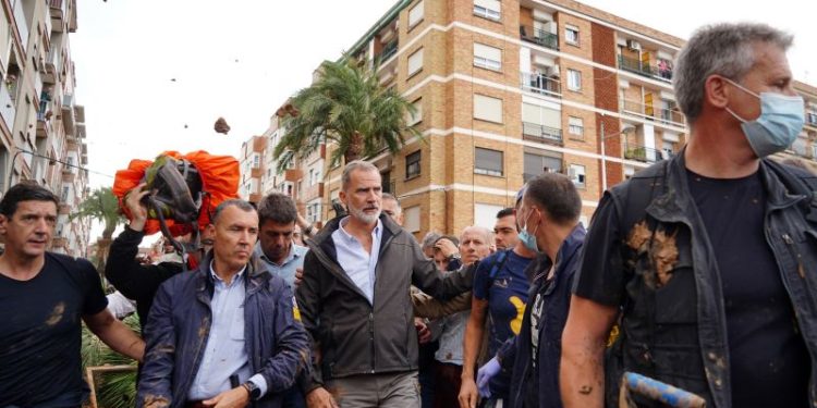 Angry crowds boo and throw eggs at Spanish king as he visits flood-hit Valencia