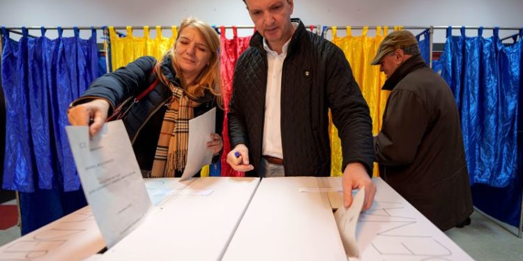 Romanians vote in parliamentary election amid turmoil over claims of Russian interference in presidential race