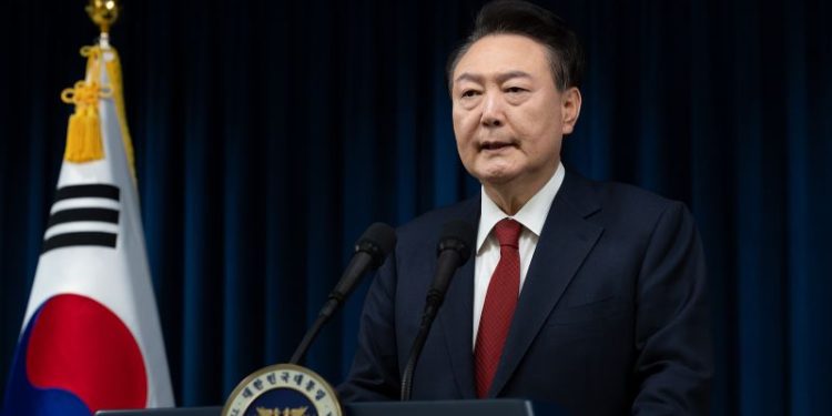 South Korea’s ruling party backs impeachment as president refuses to step down over martial law
