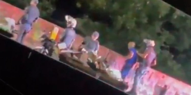 Video of military police officer throwing man off bridge sparks anger in Brazil