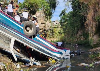 At least 50 die in Guatemala after bus plunges off bridge