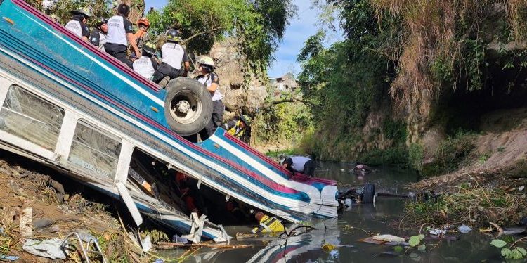 At least 50 die in Guatemala after bus plunges off bridge