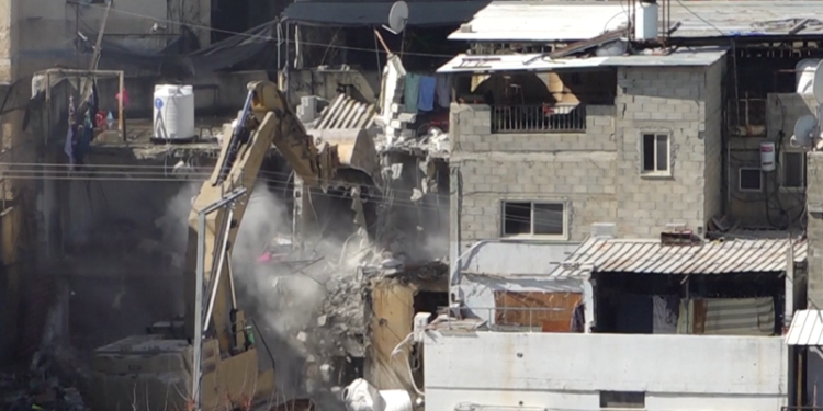 Israel demolishes West Bank apartment buildings as military campaign displaces tens of thousands of Palestinians