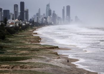 Tropical Cyclone Alfred whips up wind, rain on slow march to Australian coast