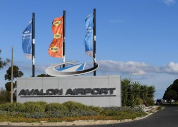 A boy with a loaded shotgun boarded a plane in Australia but was tackled by a former boxer