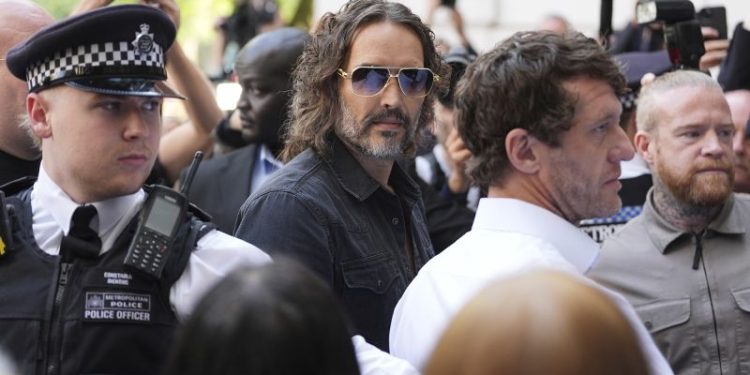 Russell Brand arrives at London court to face sexual assault charges