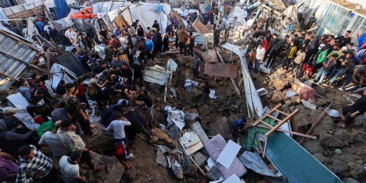 Israeli airstrike on central Gaza school compound housing displaced people kills 22, as military operation intensifies