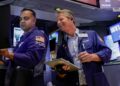 Nasdaq rises to new record; S&P 500 closes flat as oil slides for a fifth day