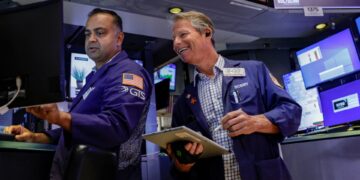 Nasdaq rises to new record; S&P 500 closes flat as oil slides for a fifth day